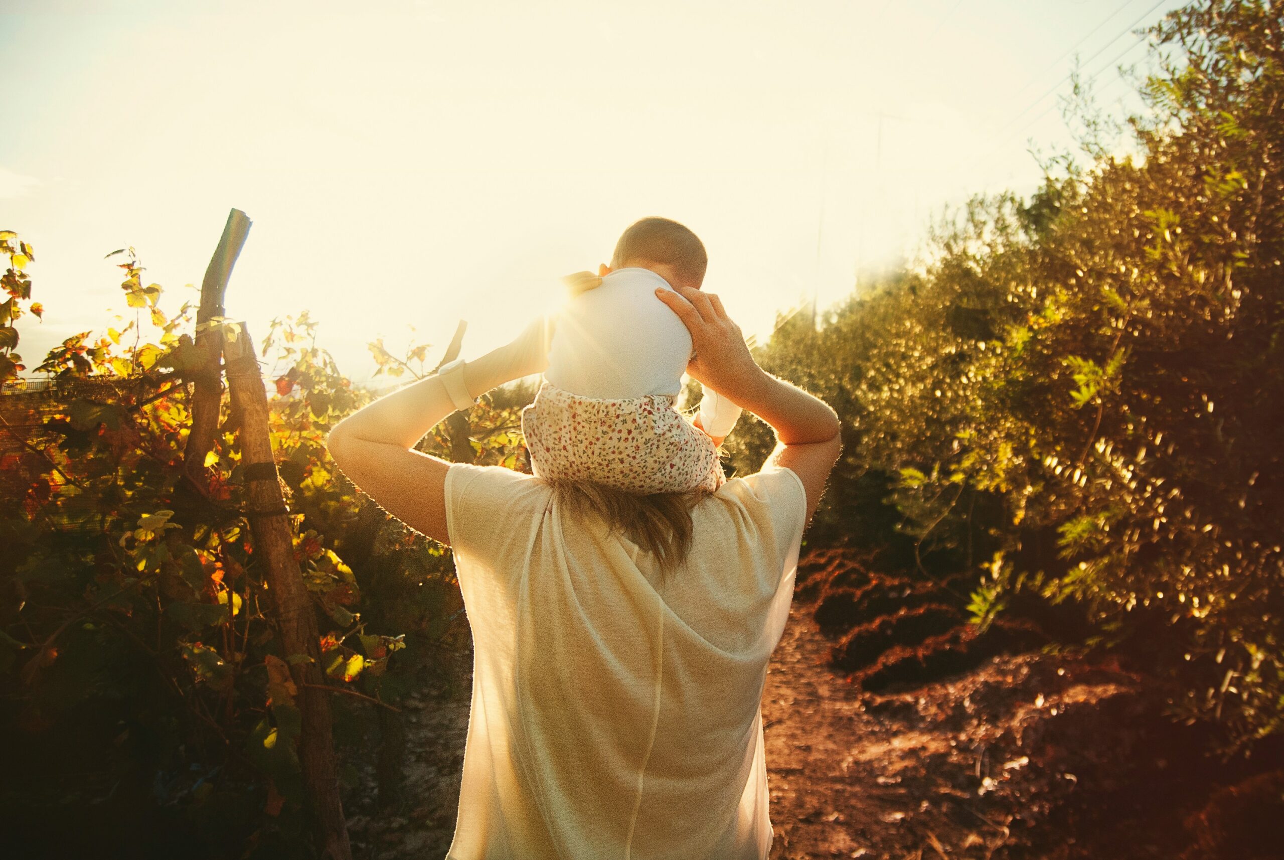 Mother holding son at garden
