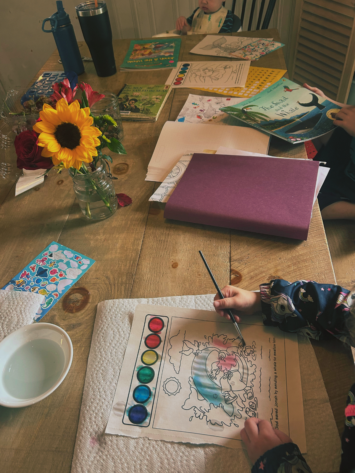 A table with art and books on it